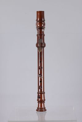 an image of a tall wooden pipe on a white surface