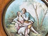 a picture of a picture of a man and a woman sitting on a bench