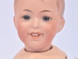 a small doll that is sitting on a table