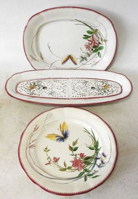 three plates with floral designs are sitting on a table