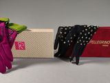 two pairs of gloves and a box with a tie on it