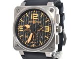 a picture of a black and yellow watch on a white background