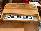 a piano that is sitting on a table