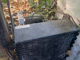 a radiator that is sitting on the side of a building
