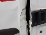 a close up of the door of a van with a red and white stripe
