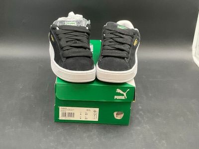 a pair of shoes that are sitting on top of a box