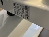 a close up of a white toilet in a bathroom