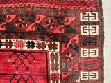 an old rug with a red and blue design on a white background