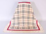 beige and black plaid skirt with red trim