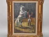 tableau représentant un homme sur un cheval blanc, dans un cadre doré