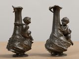 two vases that are sitting on a table