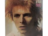 the cover of david bowie ' s album, where he is wearing a mohawk