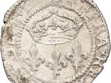 a close up of a coin with a crown on it