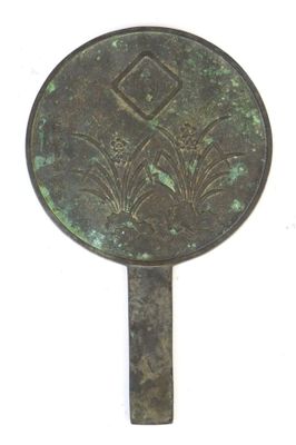 an image of a bronze mirror with a design on it