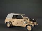 a toy army vehicle with a gun on the back of it
