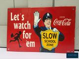a sign that says let ' s watch for em slow school zone