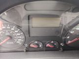 a close up of a car dashboard with various gauges