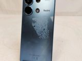 the back of a black phone with a camera on top of it