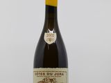 a close up of a bottle of wine on a table