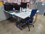 a desk with two computer monitors and a laptop on it