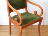 a wooden chair with green upholstered upholstered upholstered upholstered upholstered upholstered upholstered