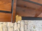 a close up of a wooden table with a metal handle