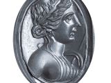 a black and white photo of a woman ' s head in a medallion