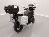 a motorcycle that is parked in a room with white walls