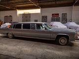 a car that is parked in a garage next to other cars