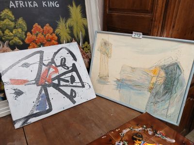 two paintings that are on a table next to each other