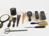 many different types of hair brushes and combs on the table
