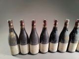 several bottles of wine are lined up in a row