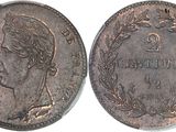 a close up of a coin with a woman ' s face on it