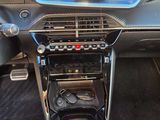 the interior of a car with a dash camera and a steering control