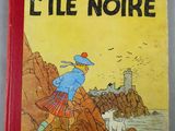 un livre sur lequel figure la photo d'un homme en kilt et d'un chien