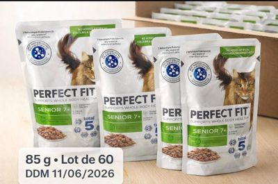 three bags of perfect fit cat food sitting on a table