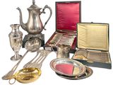 silverware and silverware in a case on a table