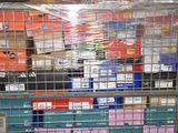 many boxes in a metal cage on the floor