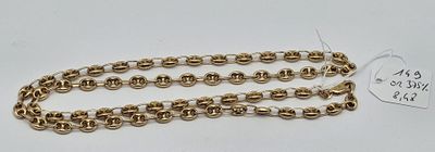 a close up of a gold chain with a tag on it