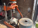 a machine that is sitting in the back of a truck