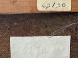 a label on a piece of paper on a piece of wood