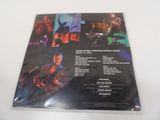 a cd with a picture of a band playing on it