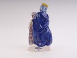 a figurine of a woman in a blue dress