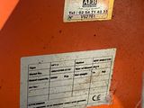 a label on the side of an orange machine