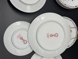 four plates with different designs on them on a table