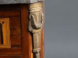 a marble top on the top of a wooden cabinet