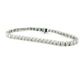 a white gold tennis bracelet with diamonds on a white background