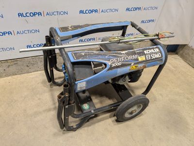 an electric pressurer sitting on top of a cart in front of a sign
