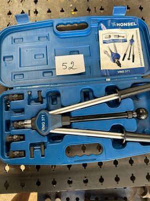a blue tool box with tools in it on a table