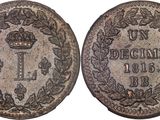 a silver coin with a crown on the front and a crown on the back